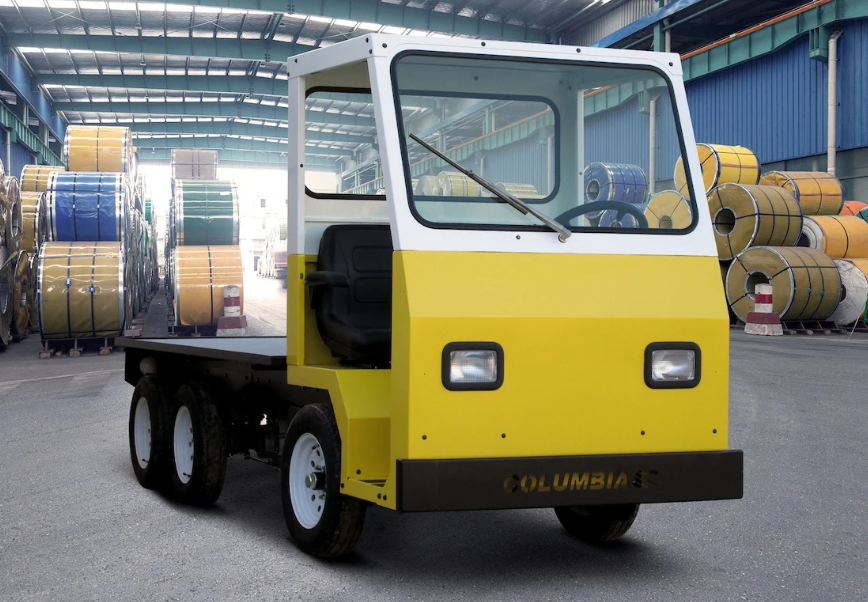 a yellow Columbia industrial vehicle in a warehouse, with a flatbed