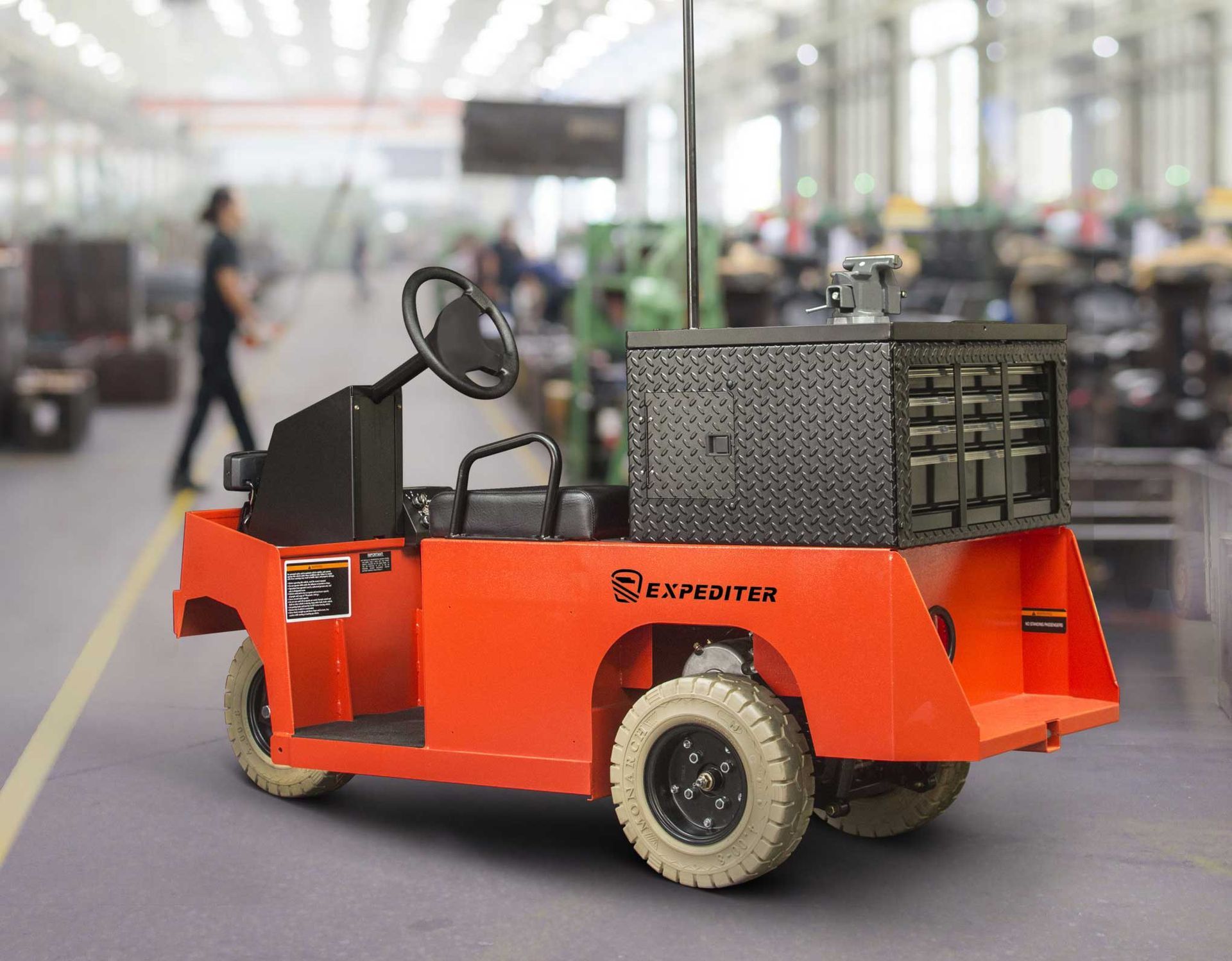 orange industrial utility vehicle in a warehouse