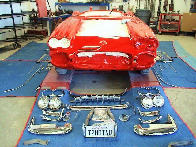 Classic car inside an auto repair shop