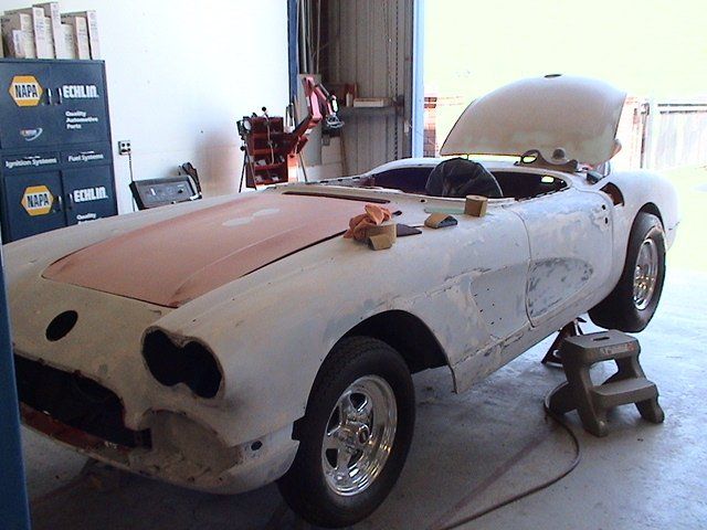 Classic car inside an auto repair shop