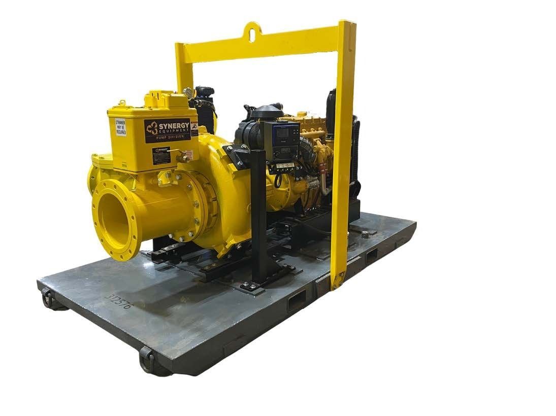 A yellow pump is sitting on top of a metal platform.