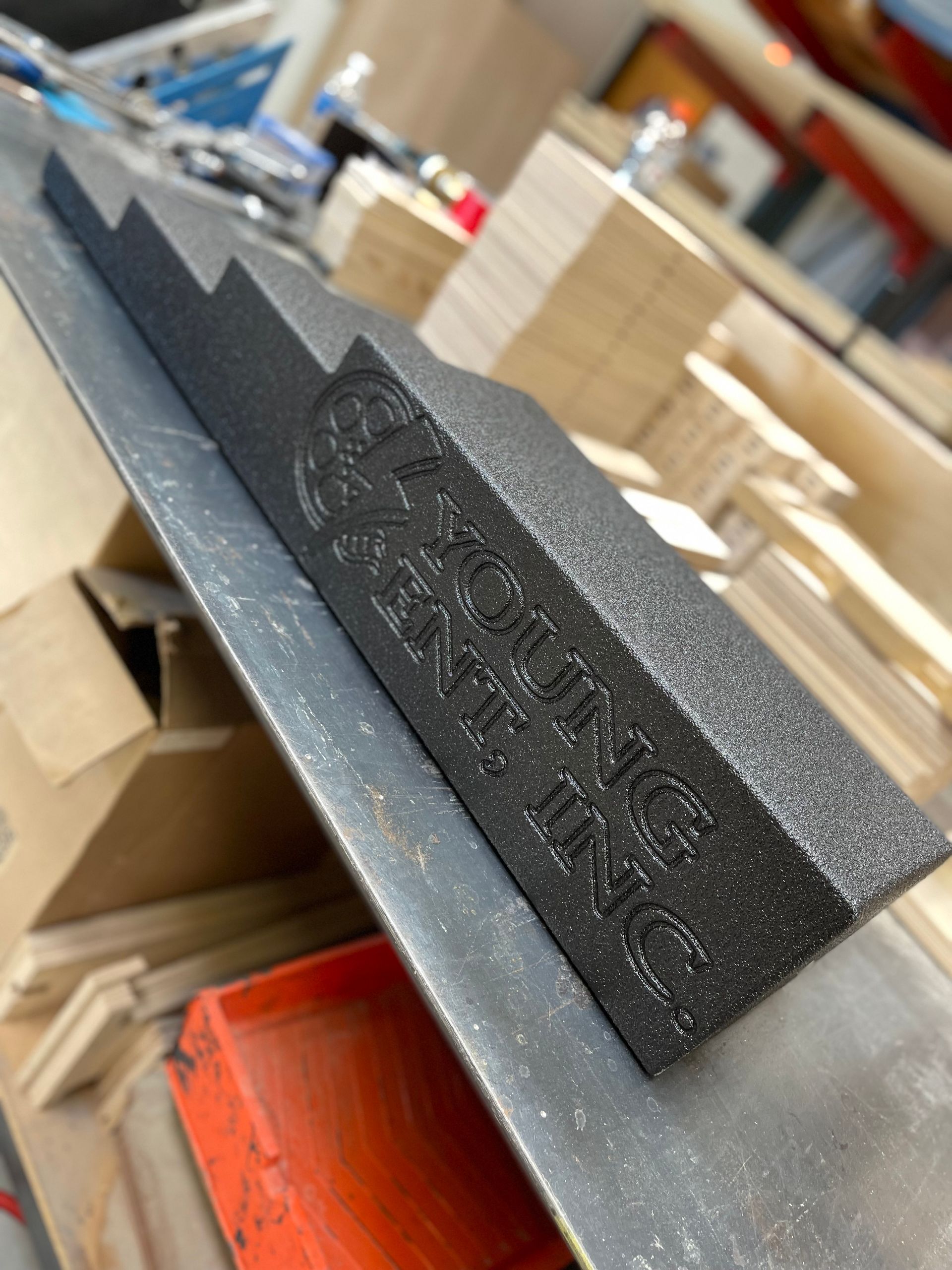 Black, textured, wedge-shaped object with 