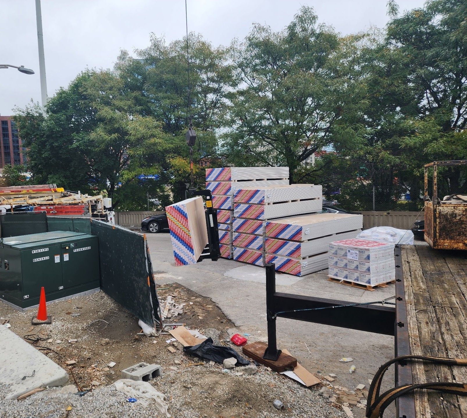 A construction site with a lot of boxes stacked on top of each other