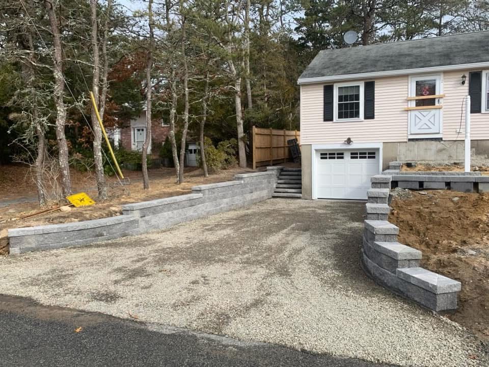 A house with a garage and stairs in front of it