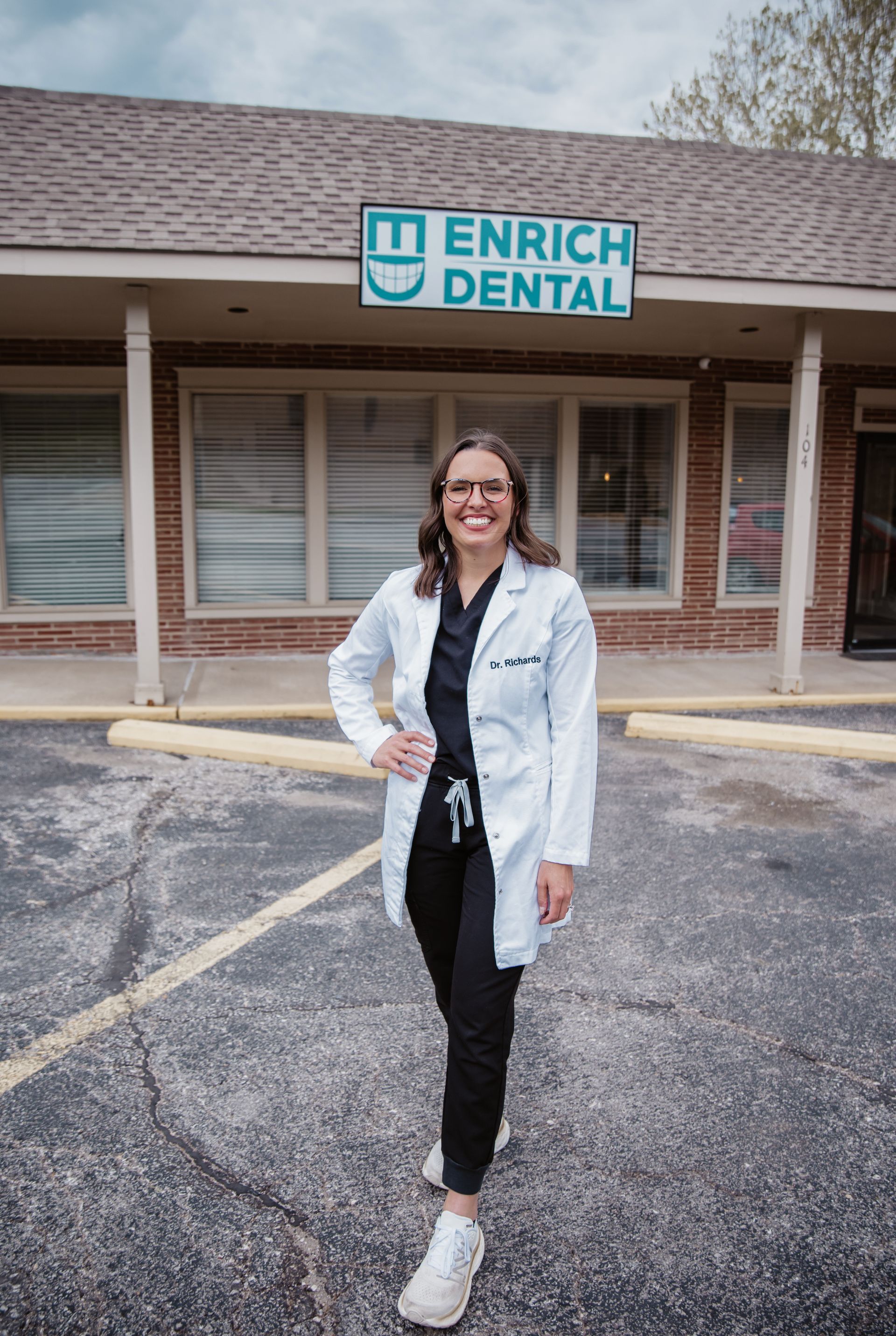 Woman in lab coat in front of 