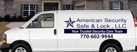 White van with "American Security Safe & Lock, LLC" logo parked in front of a house.