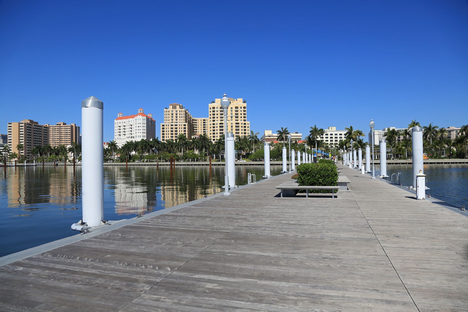 A dock with a city skyline in the background