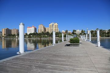 A dock with a city skyline in the background