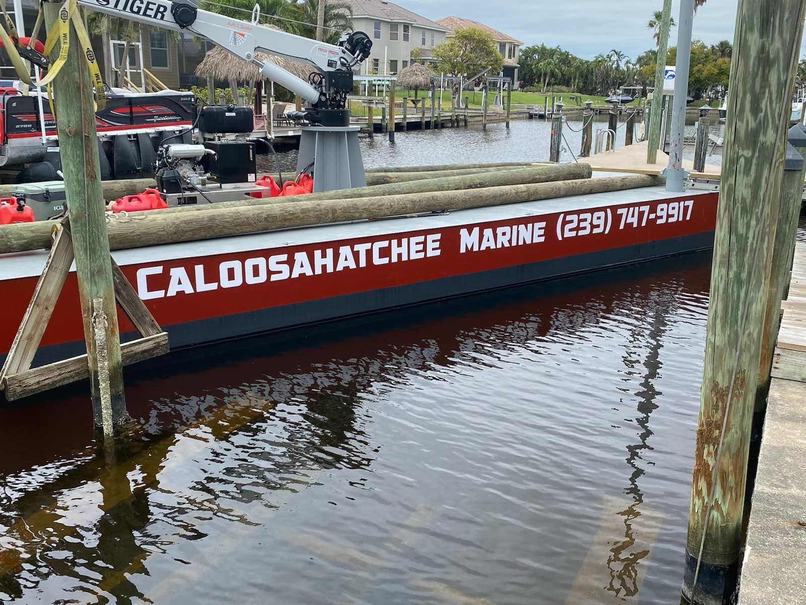 A boat with the name caloosahatchee marine on the side