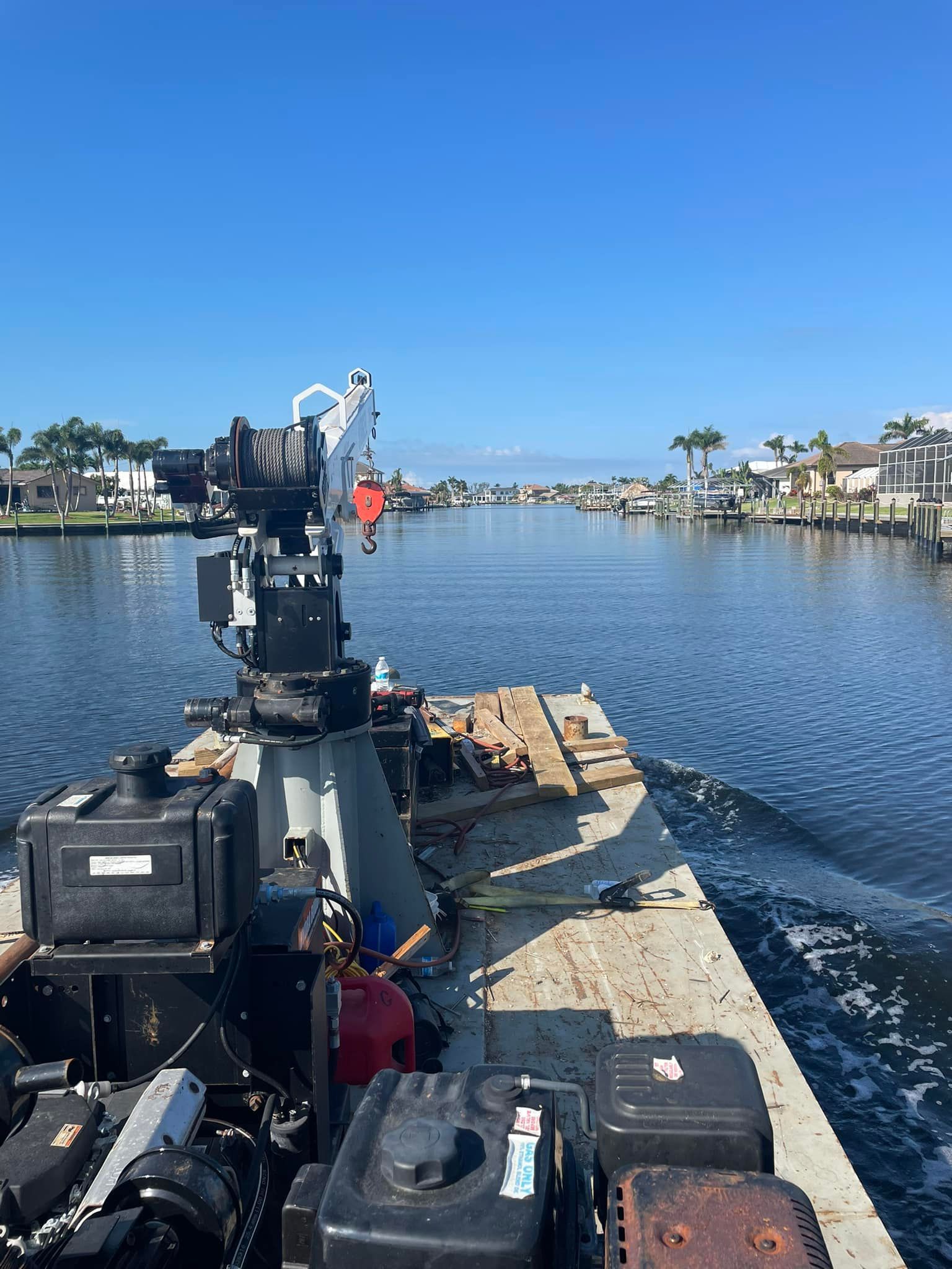 A boat is floating on top of a dock in the water.