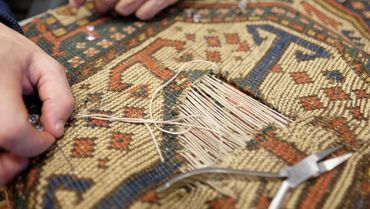 Rug being repaired