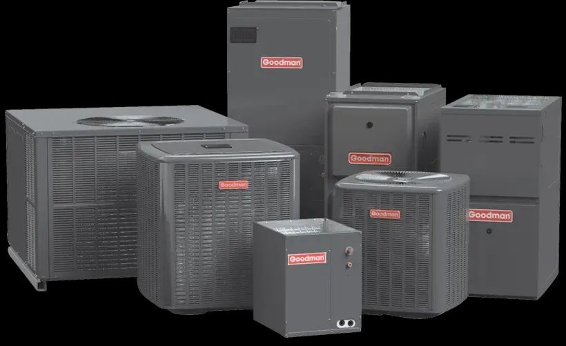 Collection of Goodman HVAC units, various sizes and types, dark gray with red logos, black background.