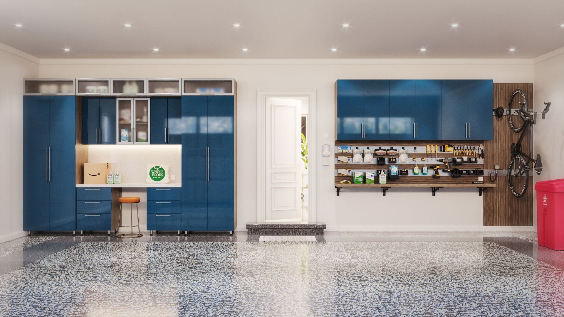 Spacious garage with blue cabinets and work area. A door and bike rack are visible. The floor has a shiny, speckled finish.