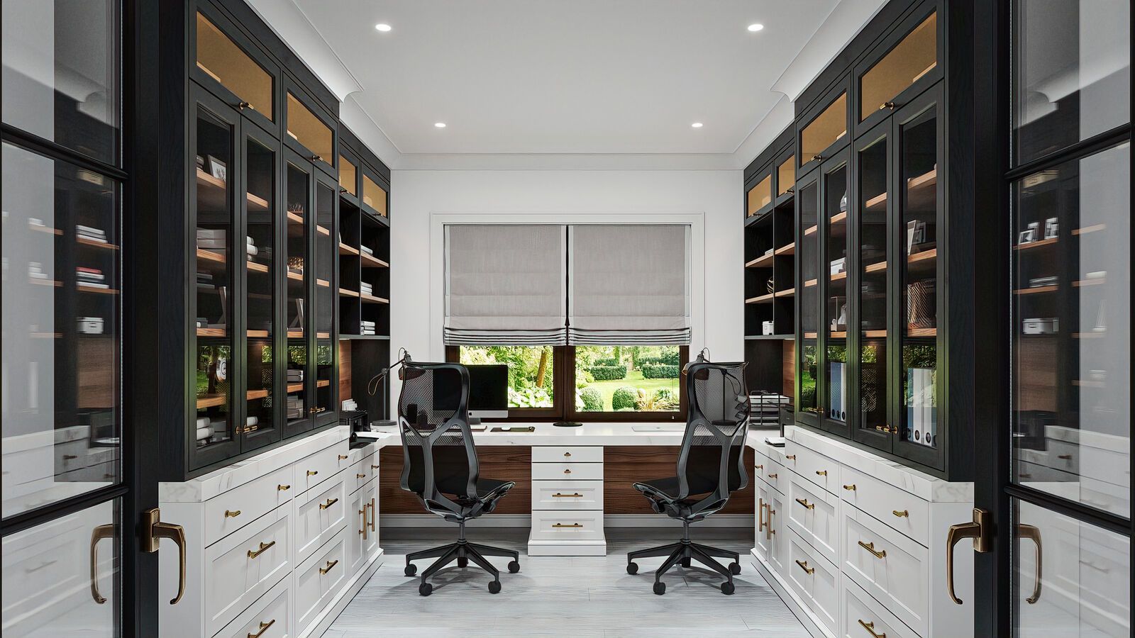 A home office with two desks, black and white cabinetry, bookshelves, and a window overlooking a garden.