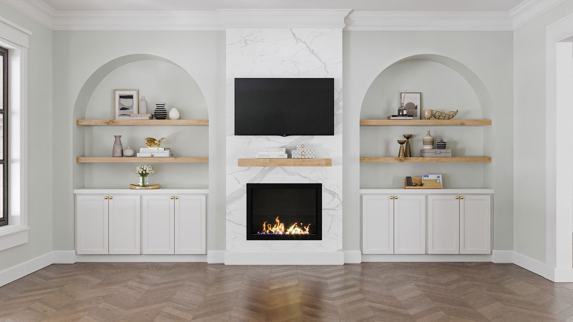 Living room with fireplace and built-in shelves. White cabinets, arch-shaped shelving, and a marble fireplace surround the TV.