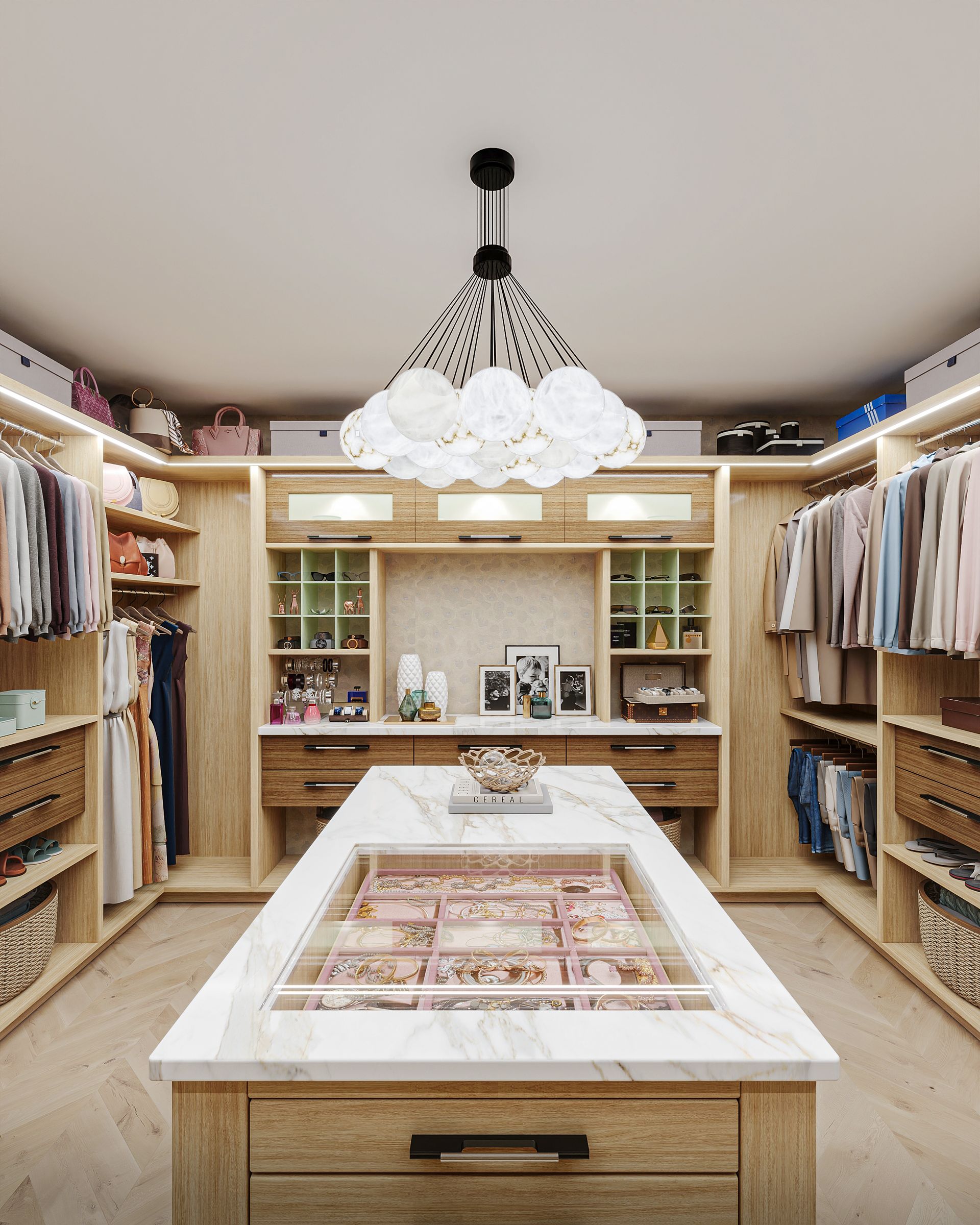 A luxurious walk-in closet with light wood cabinetry, a marble-topped island, and a decorative cloud-shaped chandelier.