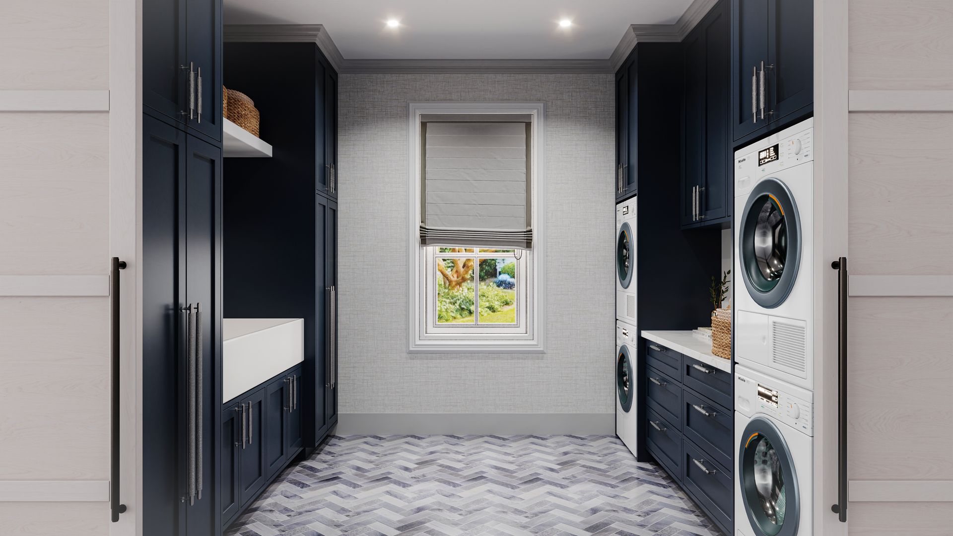 Laundry room with navy cabinets, white appliances, and a window centered on a gray brick wall.