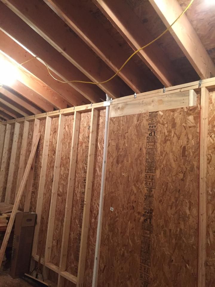 A room that is being built with a lot of wood