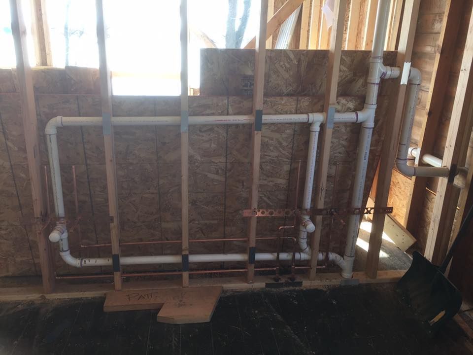 A room with a lot of pipes coming out of the wall.