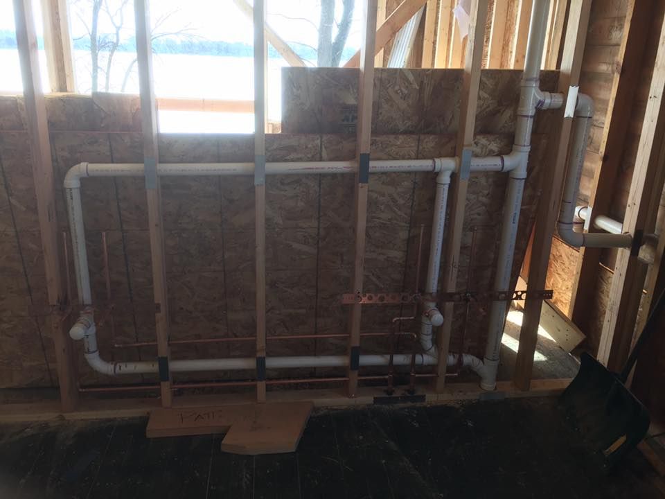 A room with a lot of pipes coming out of the wall.