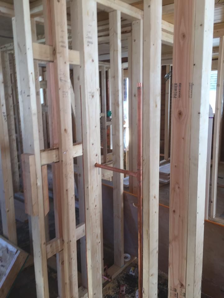A wooden frame is being built in a house.