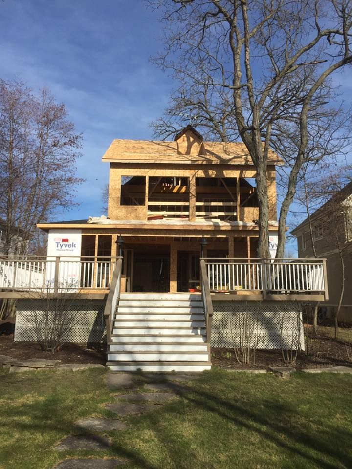 A house is being built with a deck and stairs.