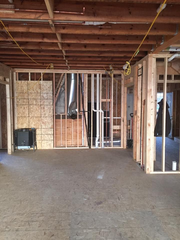 A room that is being built with wooden beams and walls.