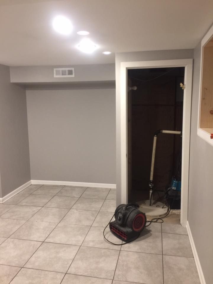 There is a fan in the middle of the room.