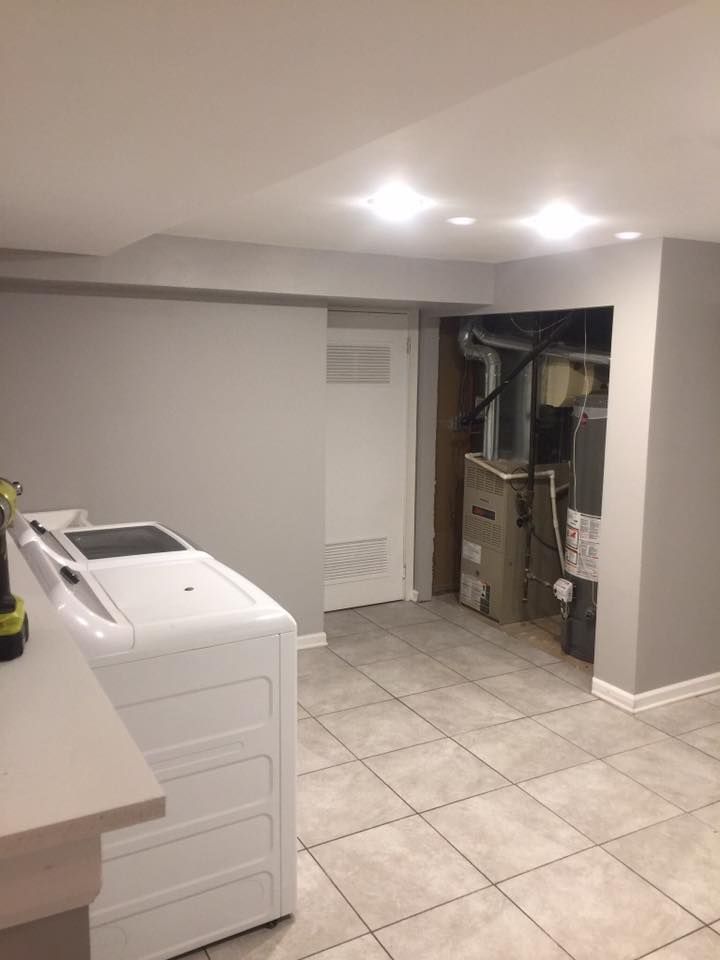 A laundry room with a washer and dryer in it.