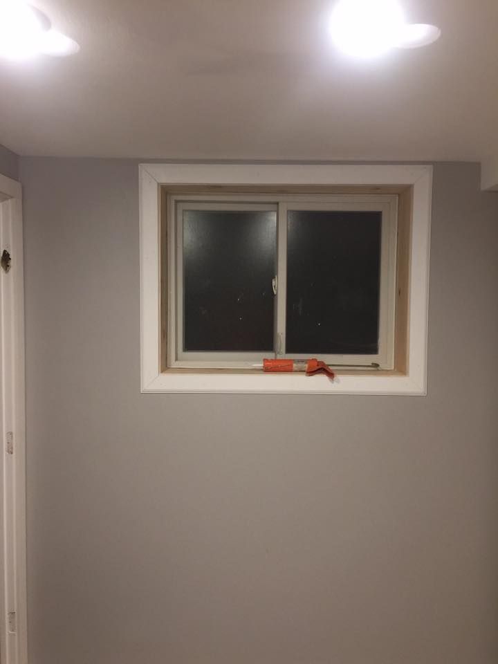 There is a window in the corner of the room.