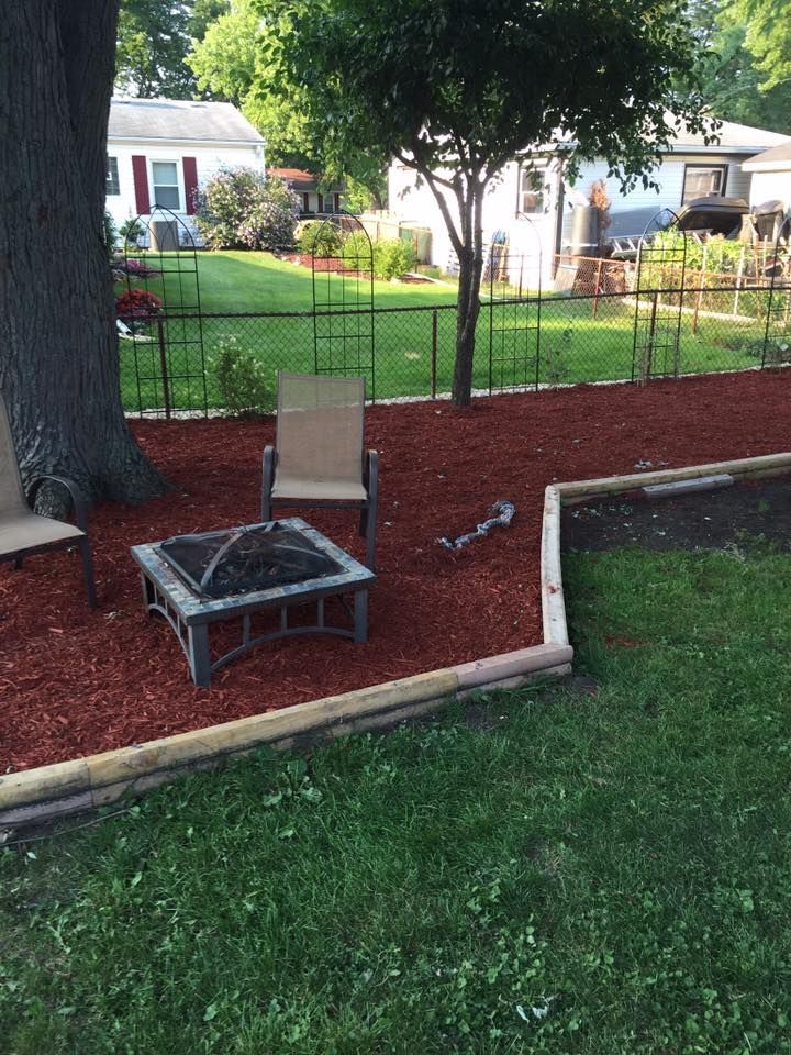 There is a fire pit in the middle of the yard.