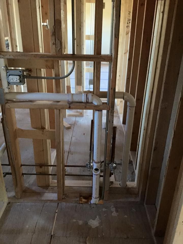 A picture of a bathroom under construction in a house.