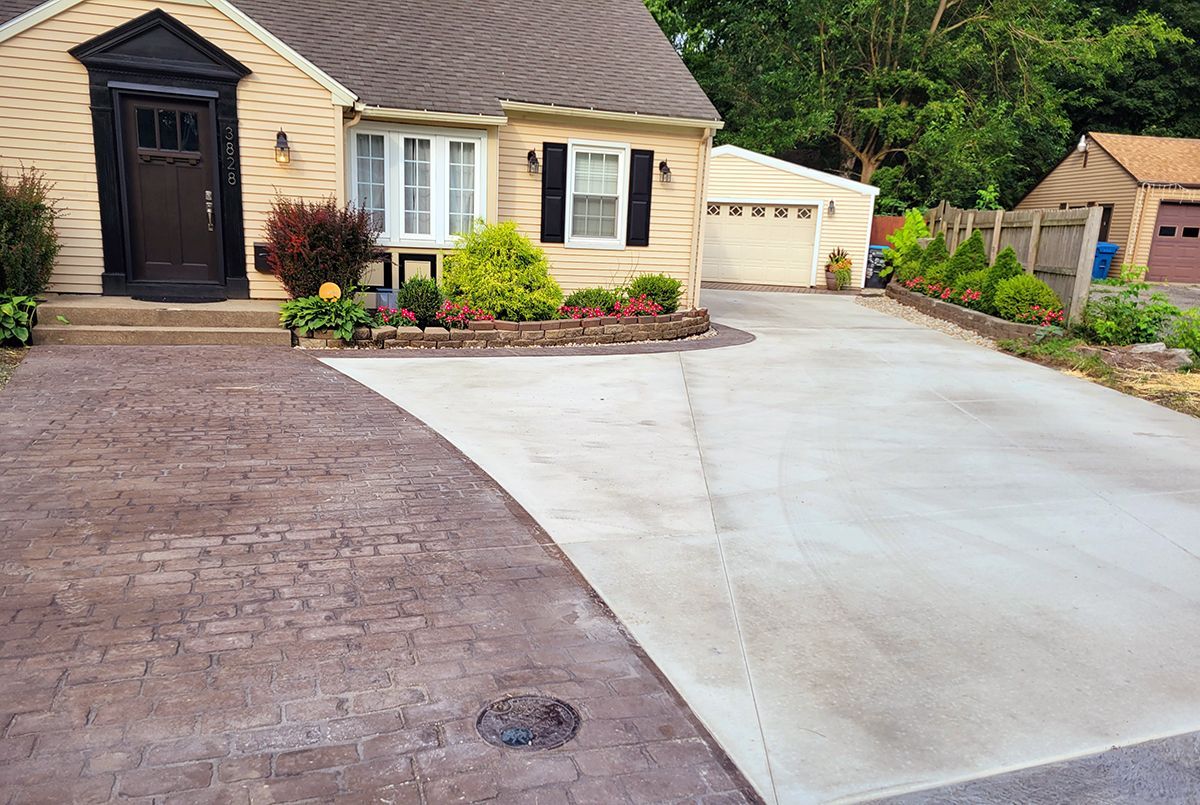 A house with a driveway leading to it and a garage.