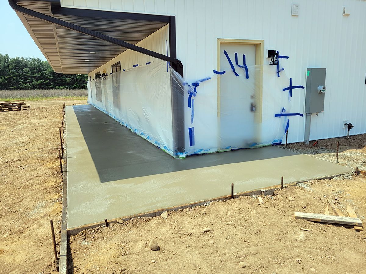 A white building with a door that has the number 14 on it