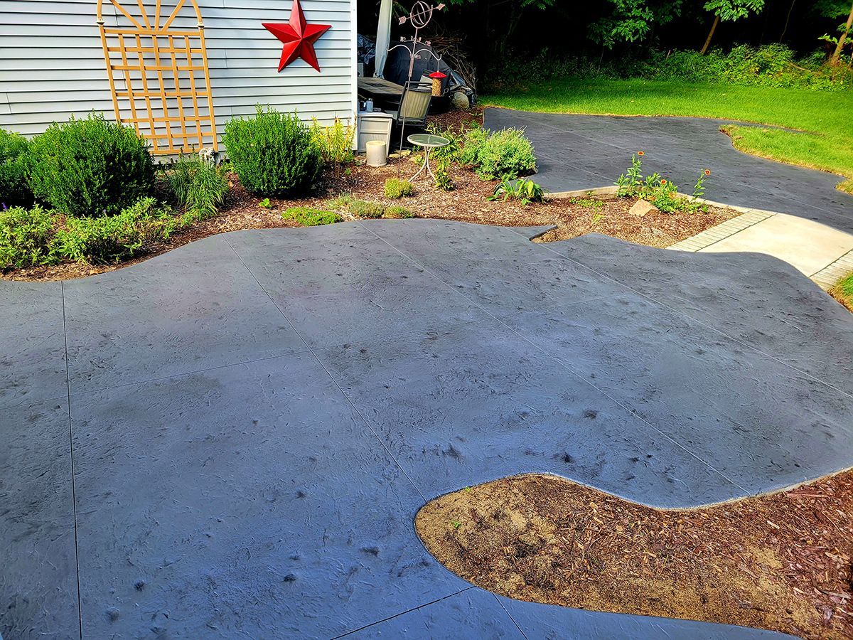 A driveway with a red star on the side of it