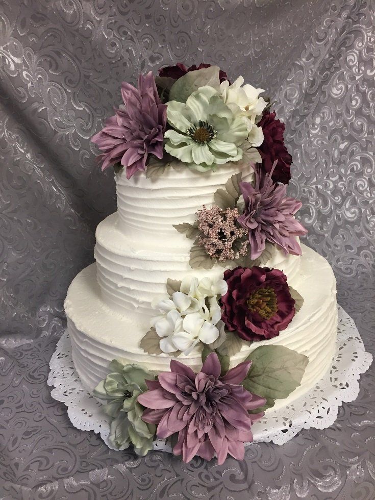 Layered ribbon with flower cascade  wedding cake