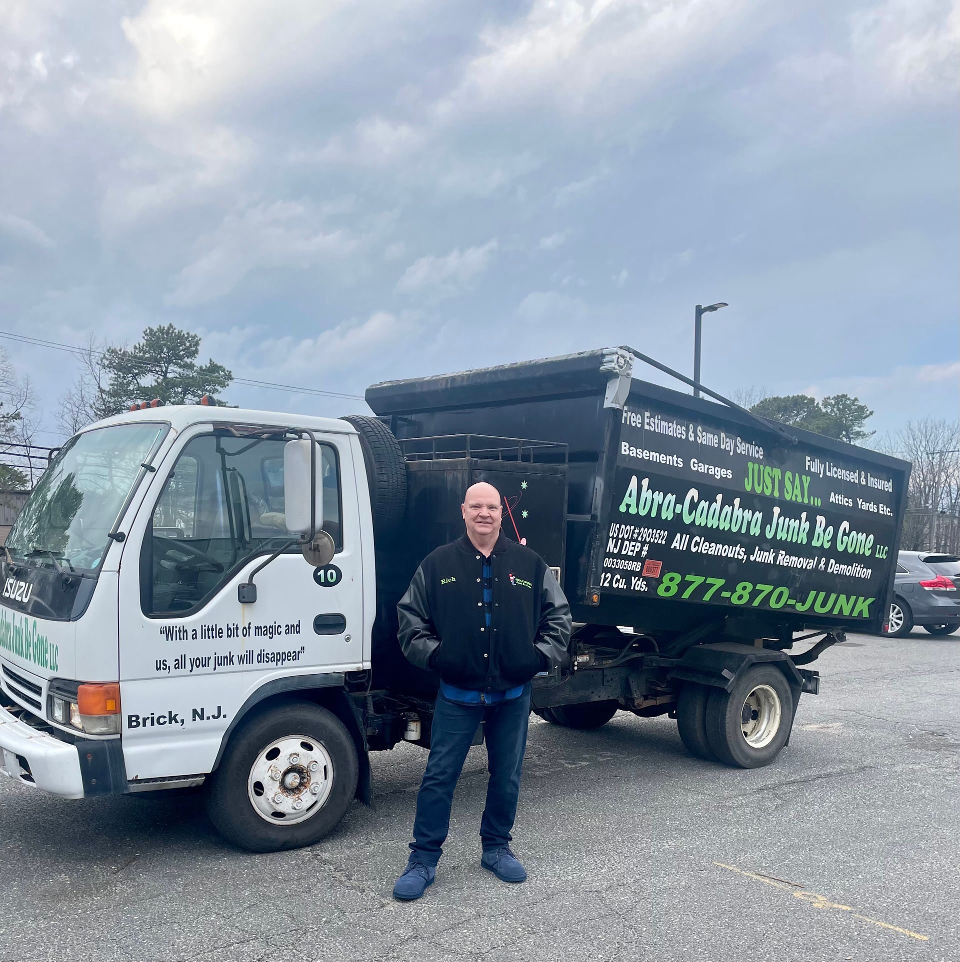 Rich standing in front of the truck