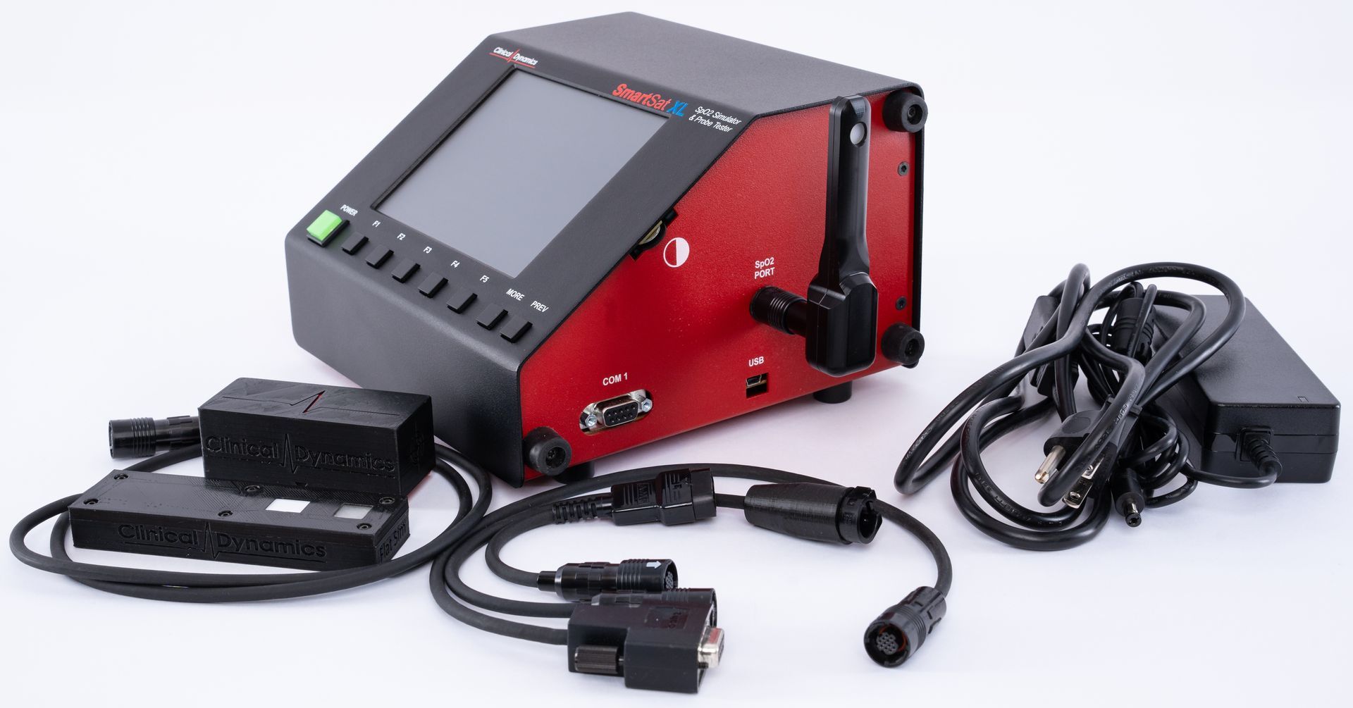 Black-and-red electronic device with screen, knobs, cables, and power adapter on a white background