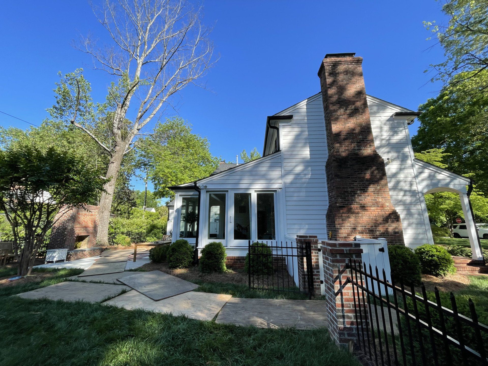 White house with surrounding trees