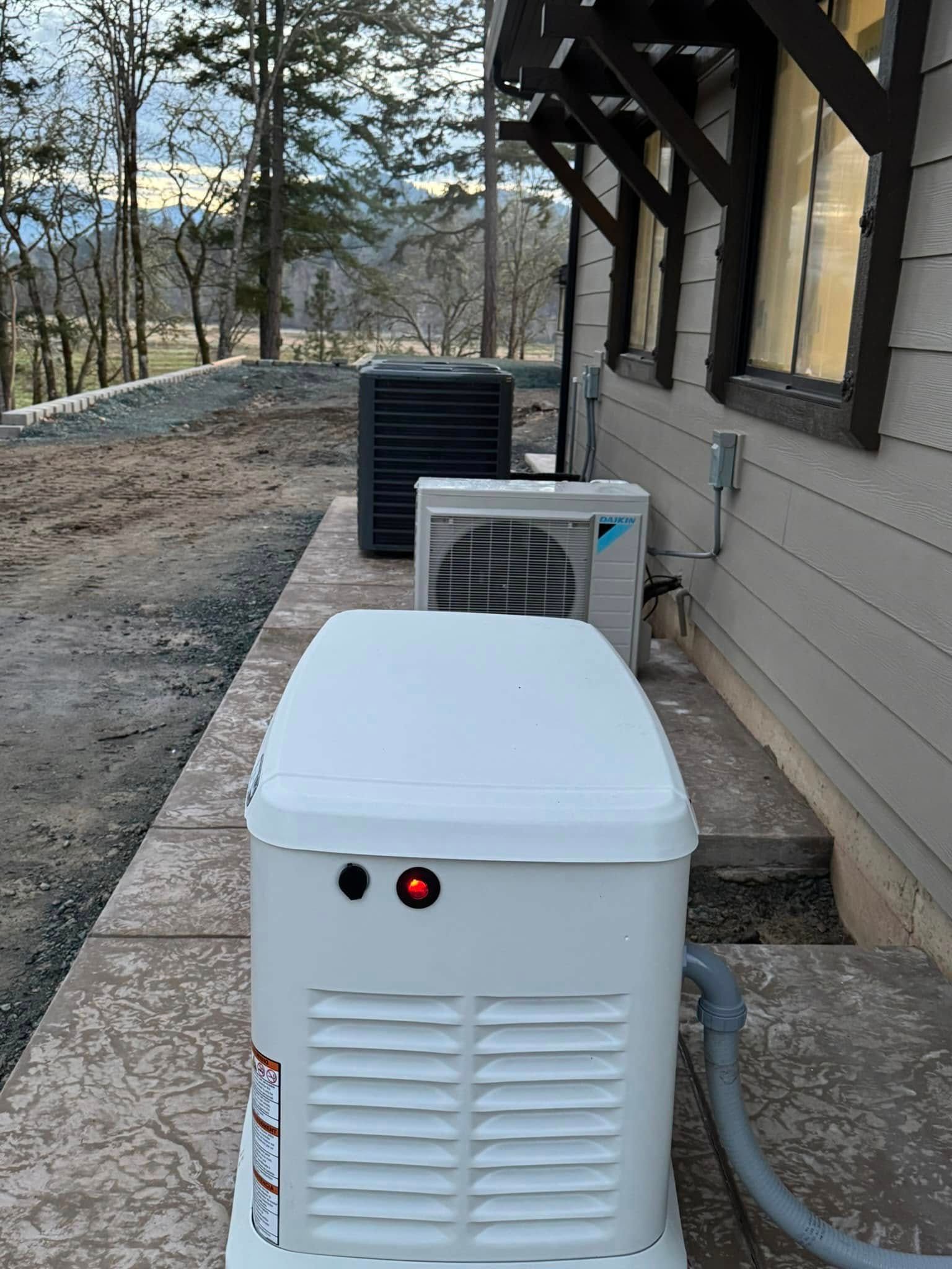 A white generator is sitting on the side of a building next to a window.