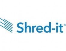 Shred-it logo: Blue text and parallel blue lines, for document shredding services.