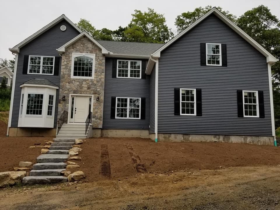 a large house with stairs leading up to it