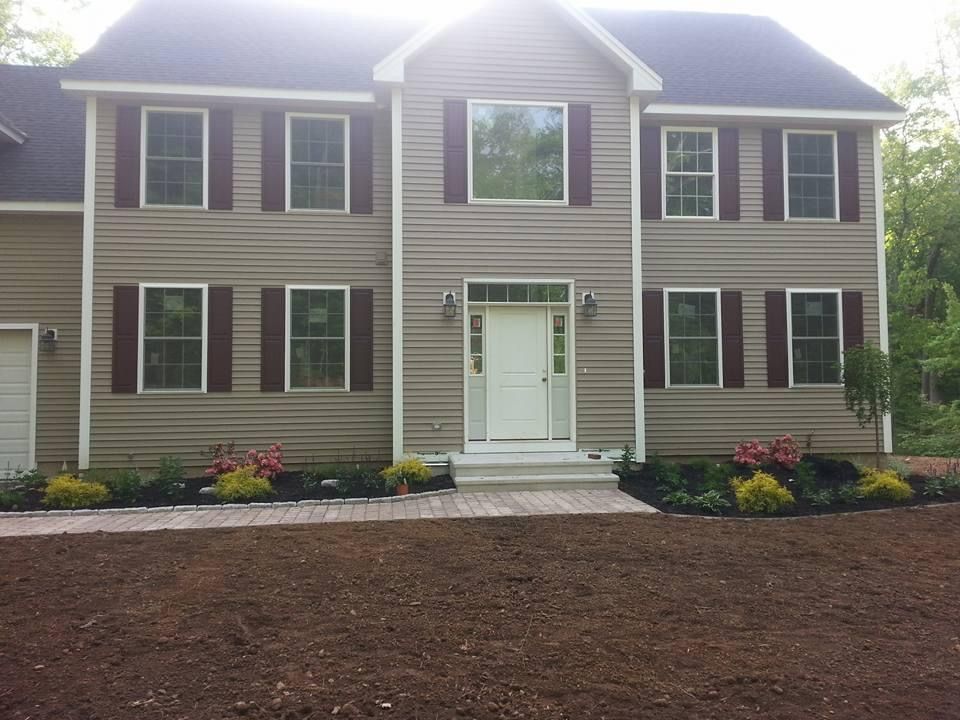 a house with a lot of windows and shutters