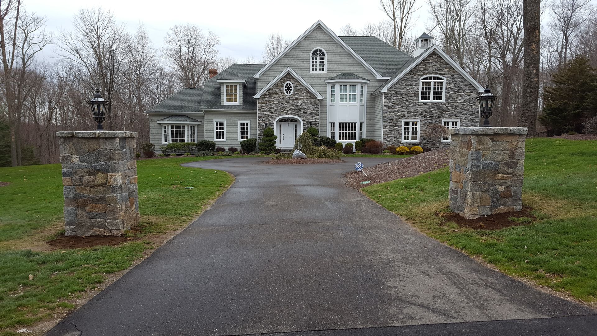 a large house with a driveway leading to it