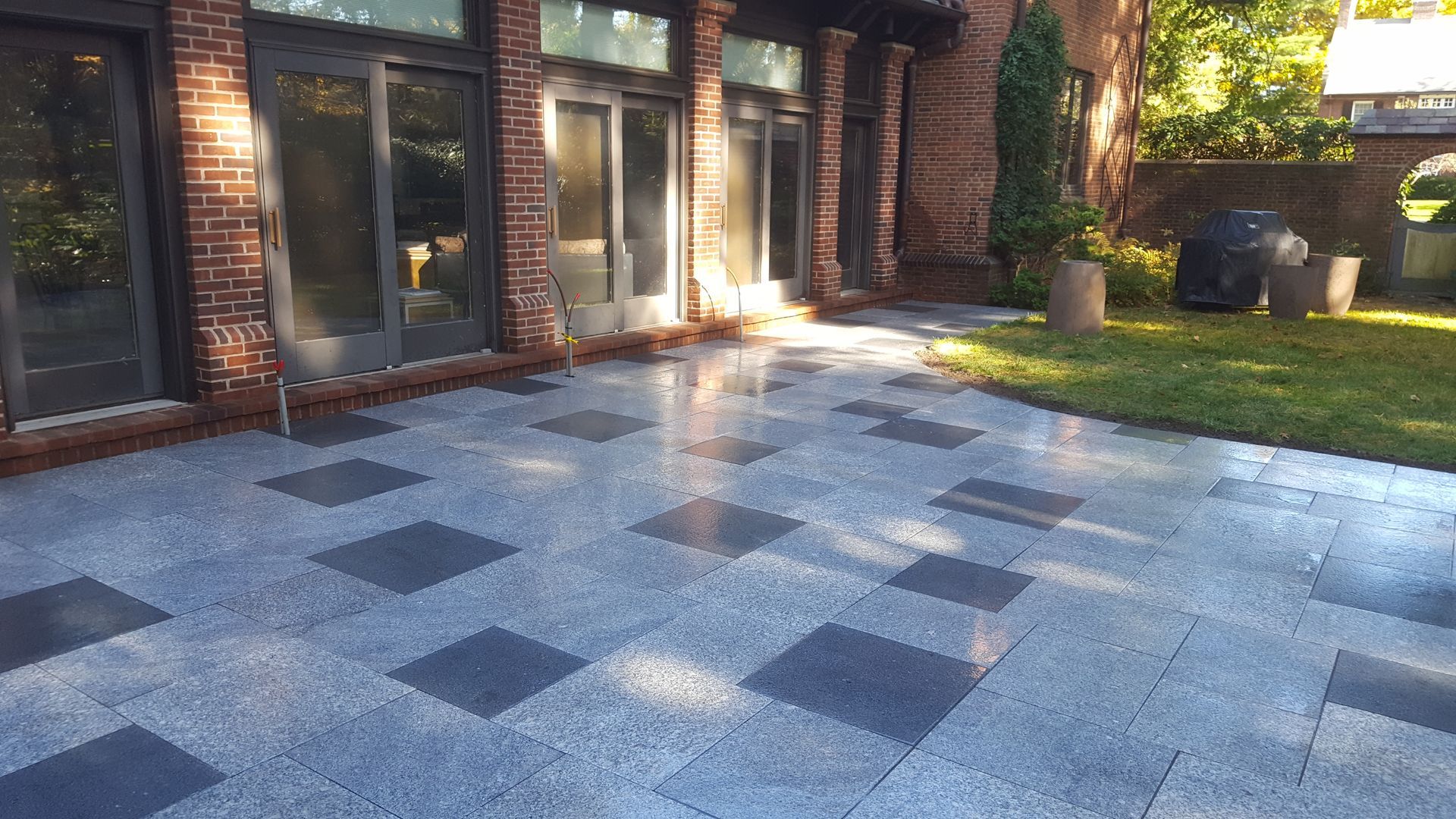 a brick building with a patio in front of it