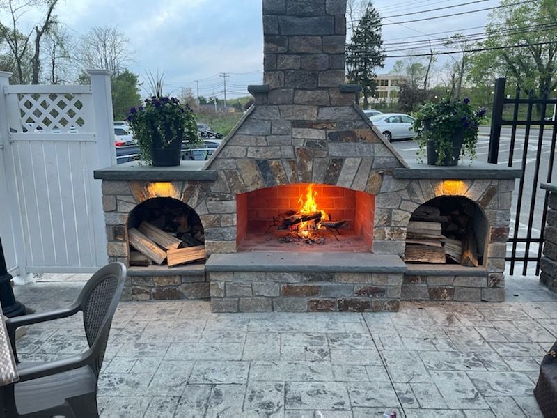 a stone fireplace in the patio