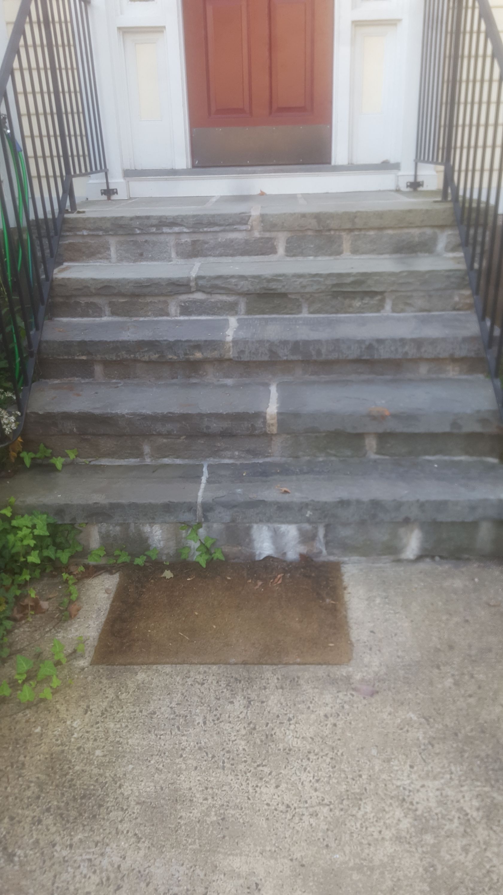 a set of stairs leading up to a doorway of a house
