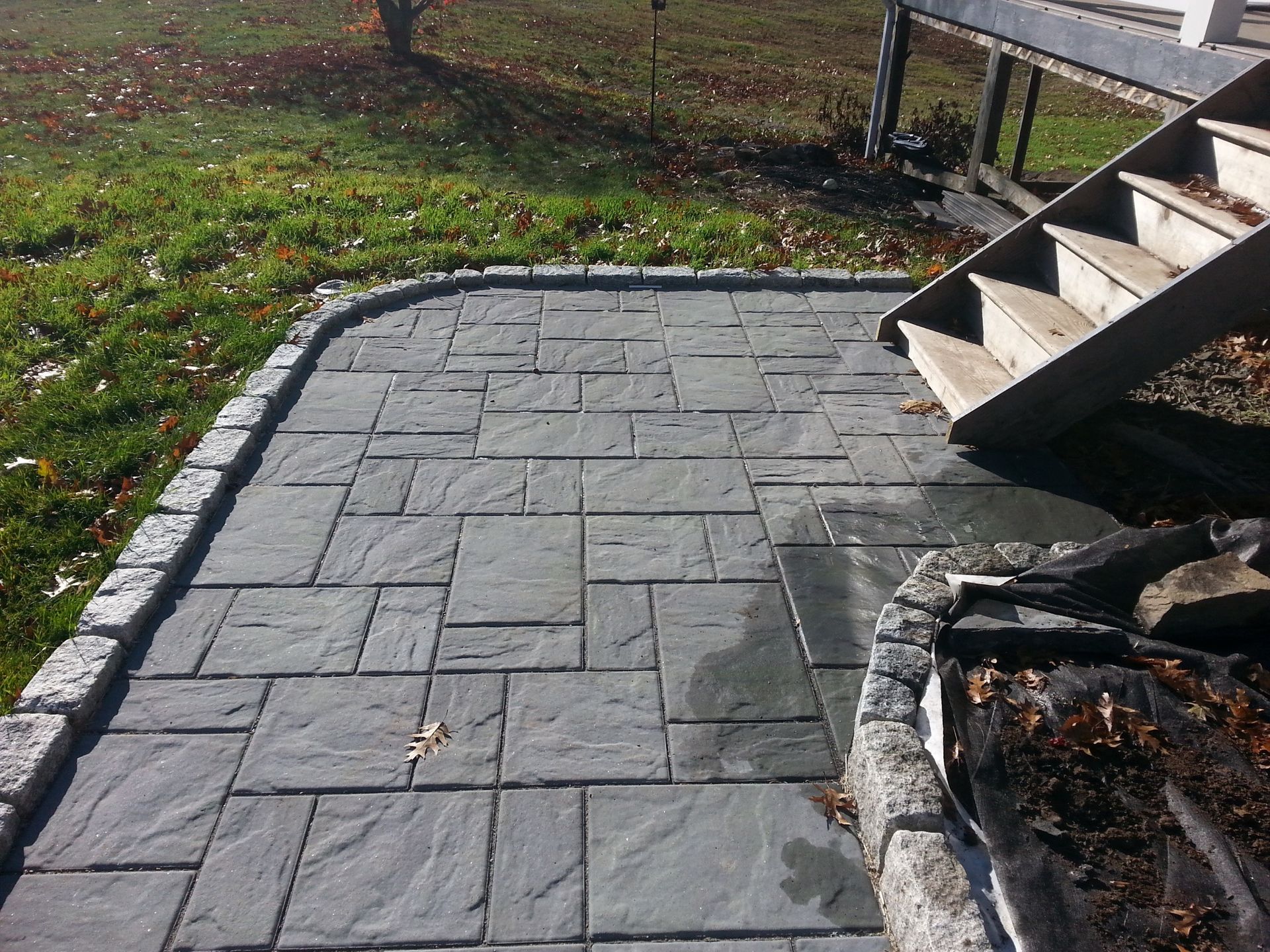 a brick walkway with stairs leading up to it