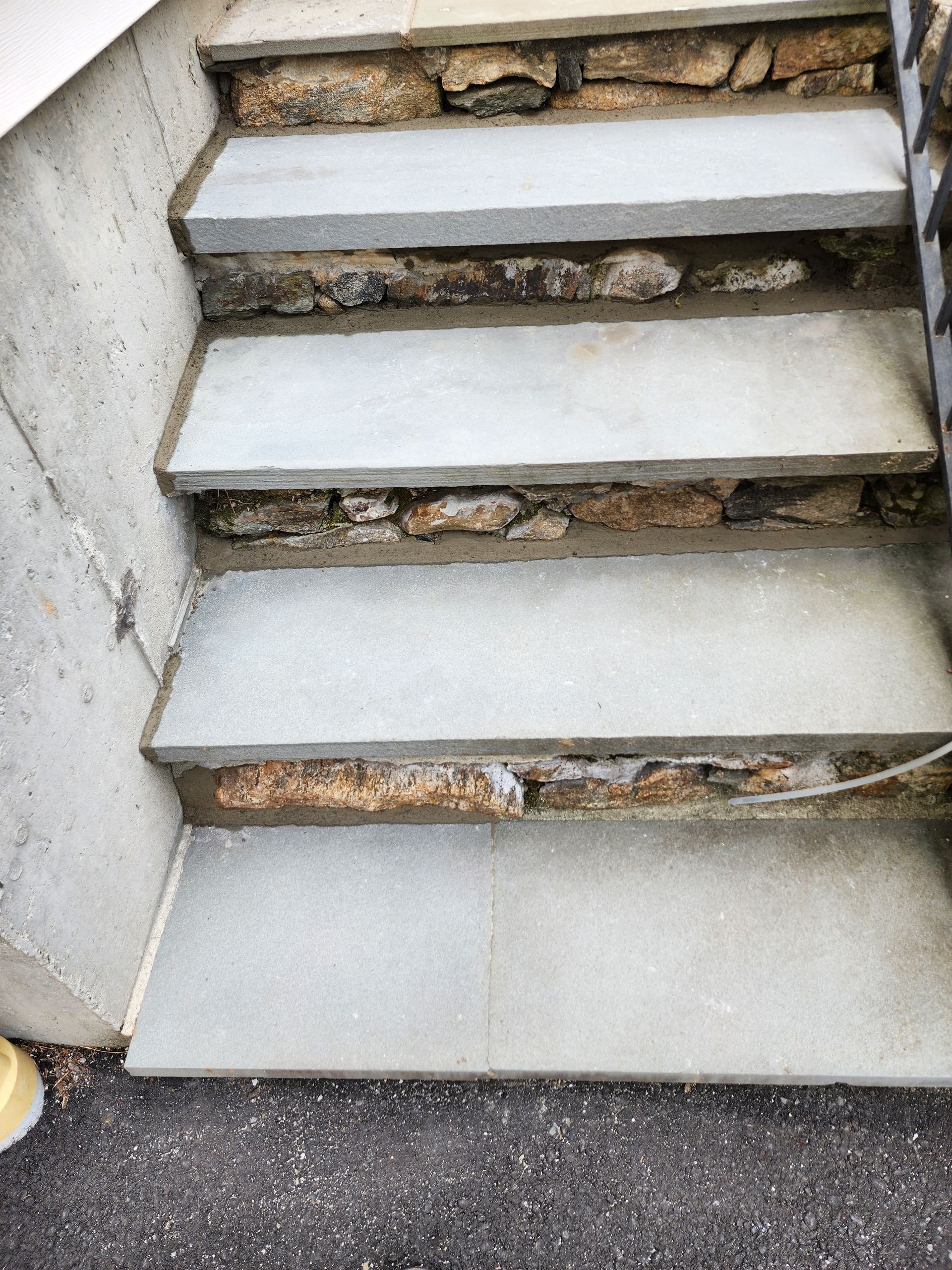 a set of stairs made of stone and concrete