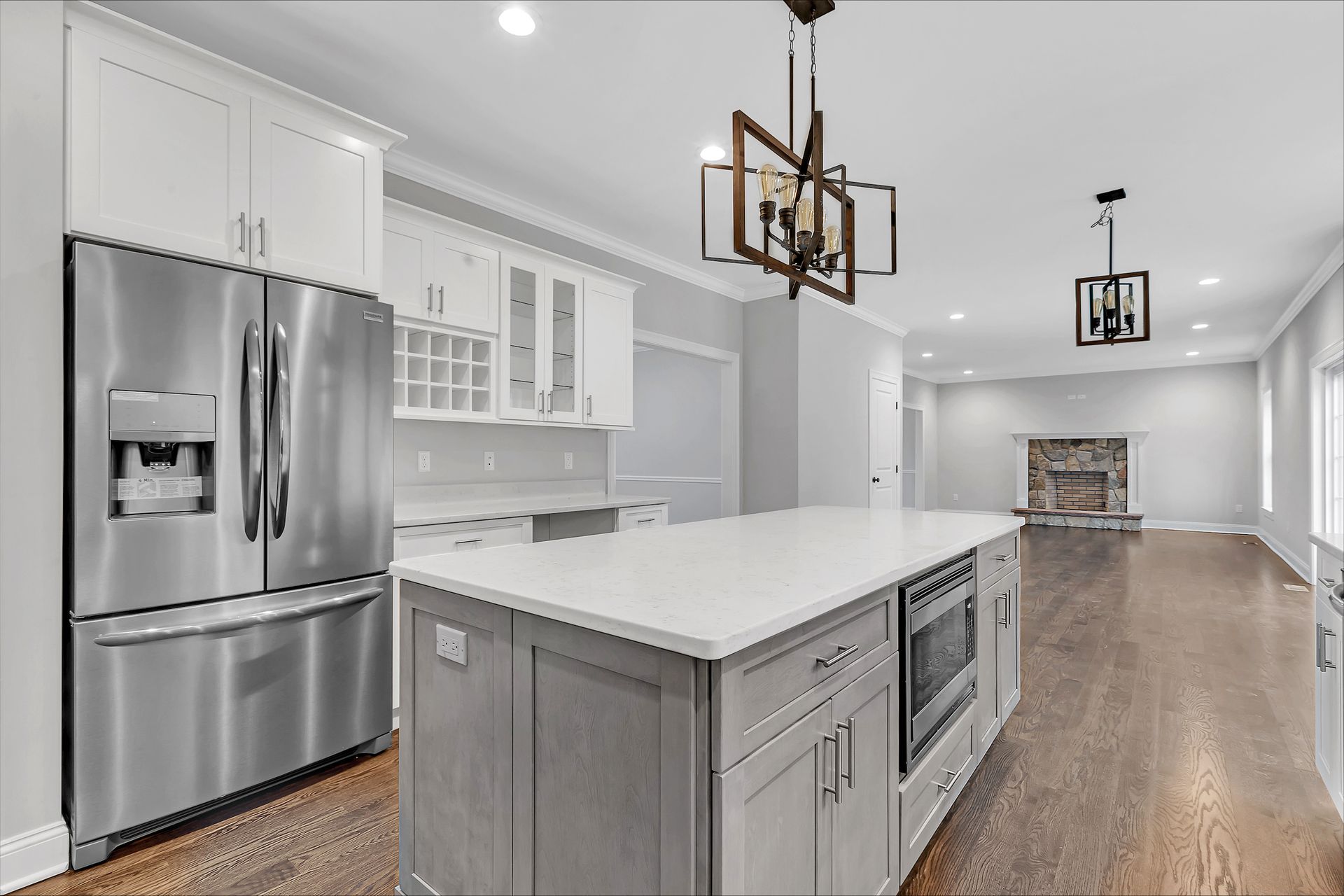 a kitchen with stainless steel appliances and a large island